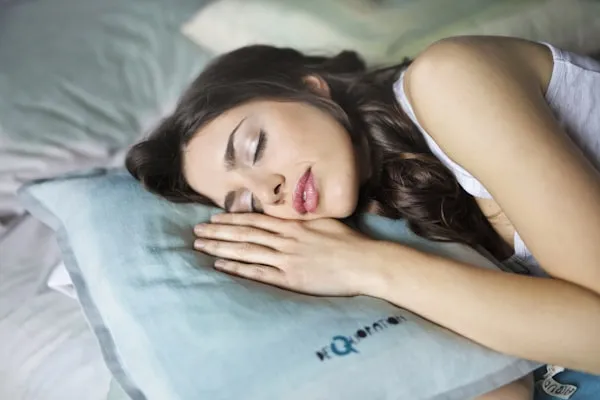Peaceful woman experiencing restorative deep sleep